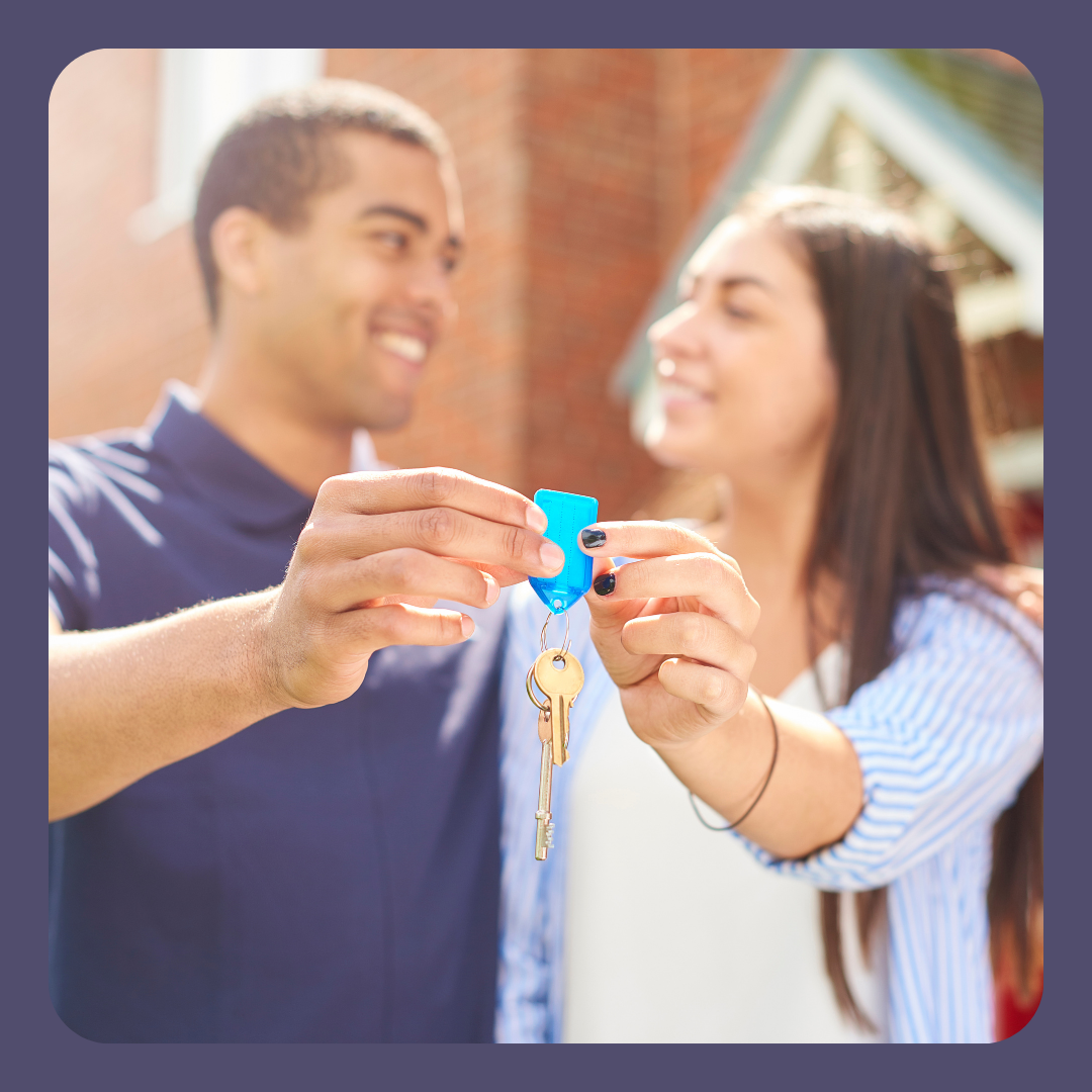 PIcture of Homeowners holding up keys